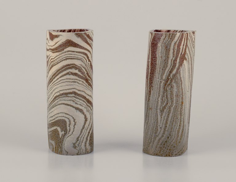 European Studio Ceramicist.A pair of unique ceramic vases.