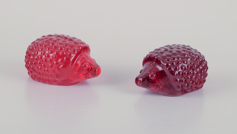 Swedish glass artist, Eneryda, Sweden.Two hedgehogs in two shades of red art glass.