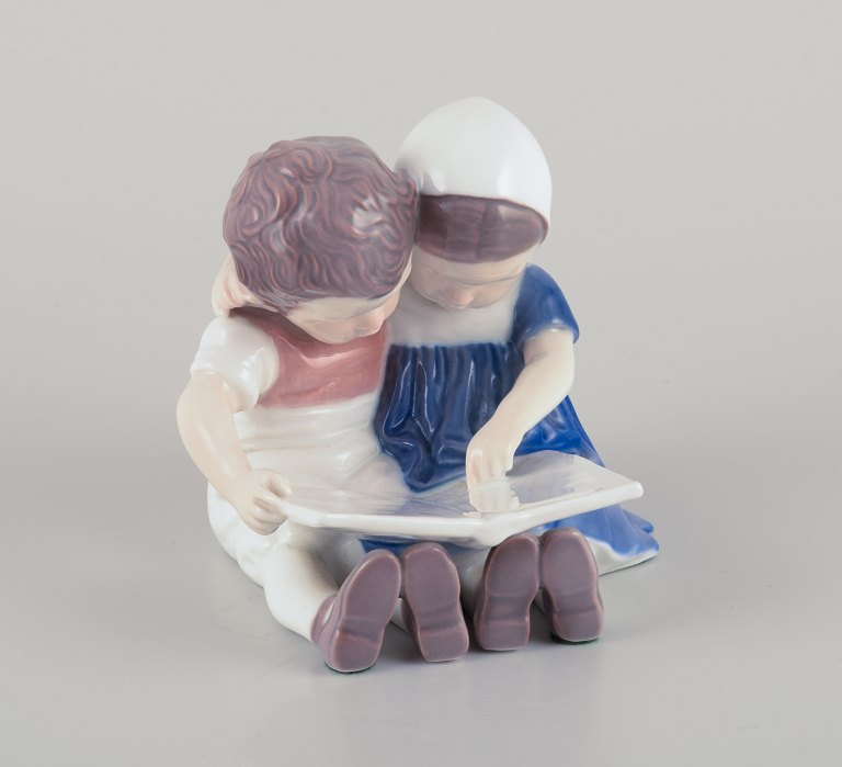 Bing & Grondahl, Denmark.Porcelain figurine of reading children.