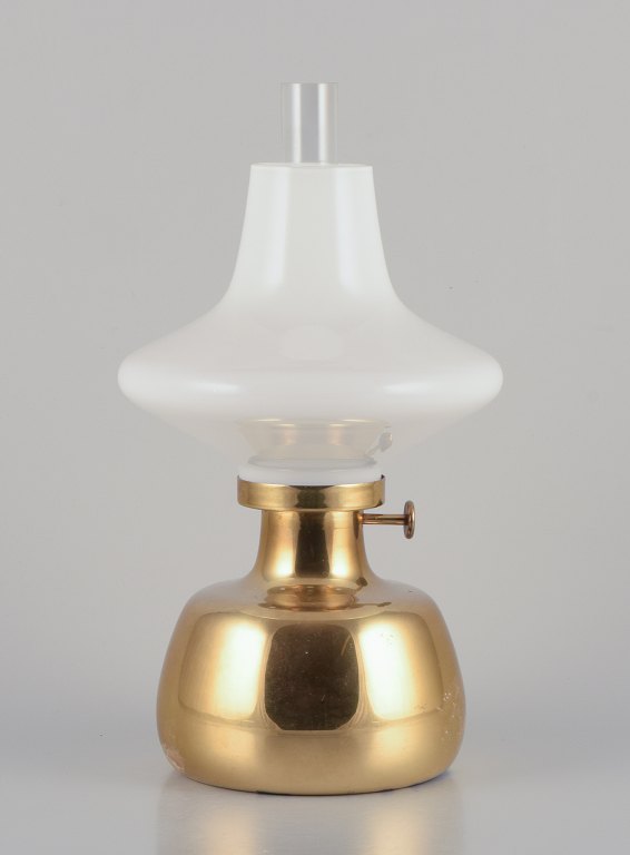 Henning Koppel for Louis Poulsen. Petronella oil lamp in brass with opal glass shade.