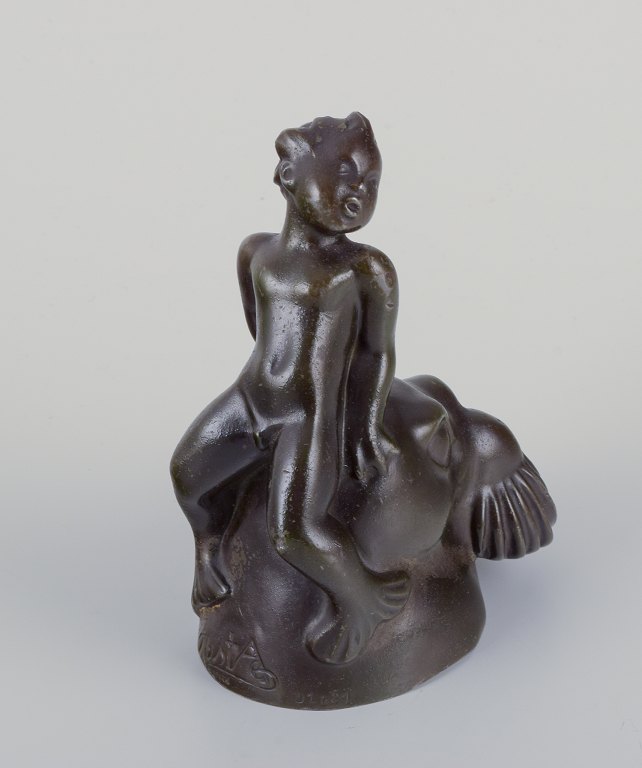 Just Andersen, Danmark.
Figur af havdreng siddende på hovedet af hvalros.