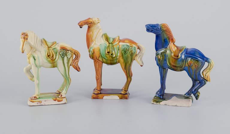 Three Chinese Tang horses in earthenware.