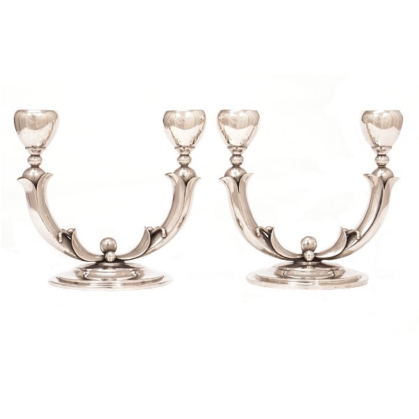 Pair of Danish silver candelabra by P. Hertz, Copenhagen, 1936. H: 15cm. W: 
16,5cm (each)