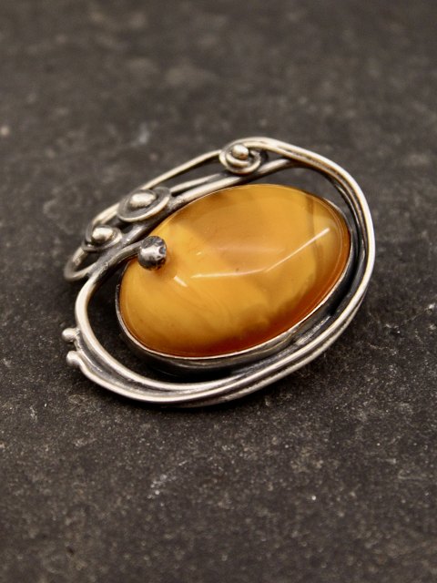 Sterling silver brooch with amber