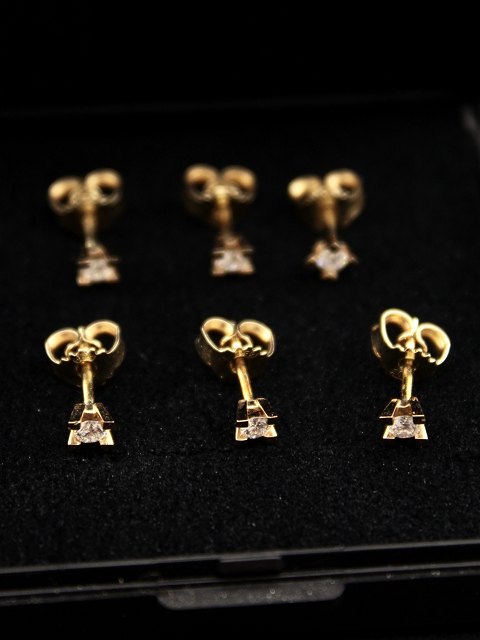 Set of 6 14 karat gold earrings with diamond
