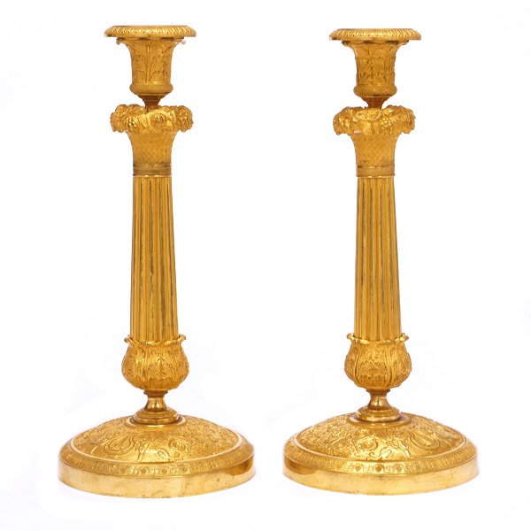 Pair of fire gilt Empire bronze candlesticks. France ca. 1810. H: 30,5cm