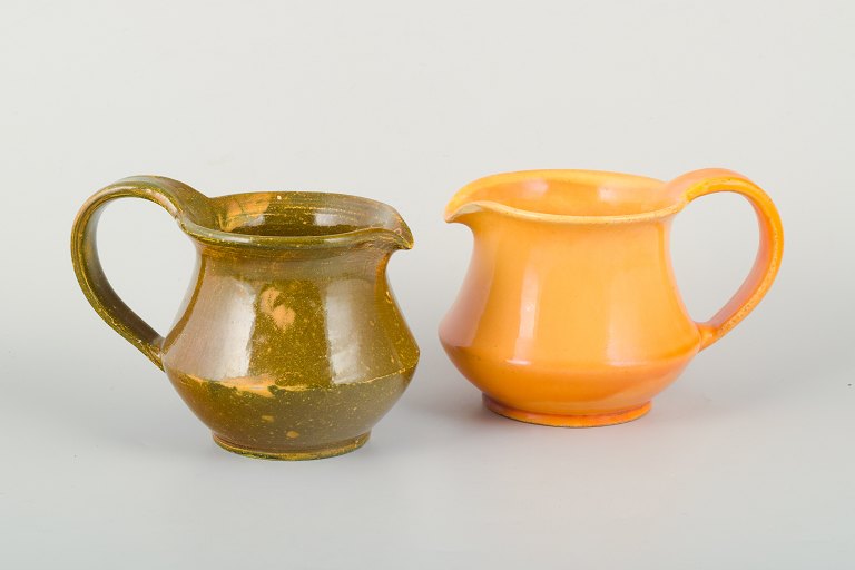 Kähler pitchers with uranium glaze.