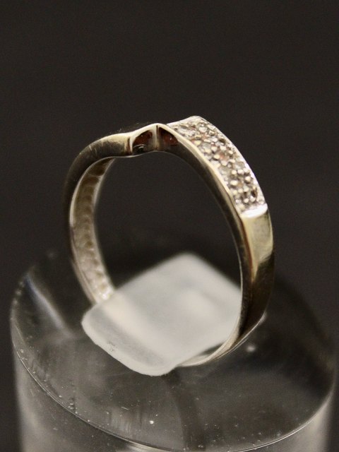 14 carat white gold ring with small diamonds