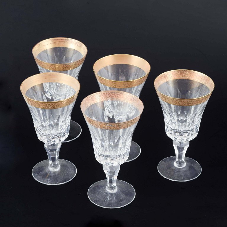 Five crystal glasses with gilt rim, mid-20th century.
