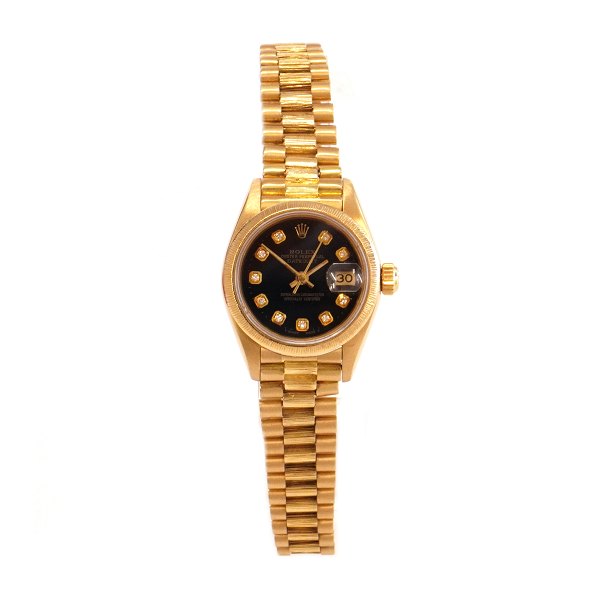 18kt gold Rolex Oyster Perpetual Datejust ref. nr 69178. D: 26mm. With box and 
papers. Sold 23/12 1985